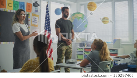 American Military Man Giving Lecture to Curious Primary School Students About Discipline and Army 130297405