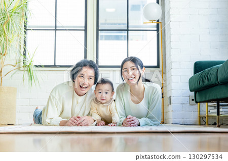 A family relaxing in the living room A family relaxing in the living room 130297534