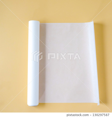 Baking paper on color background. Concept of accessories for cooking and baking Baking paper on color background. Concept of accessories for cooking and baking 130297587