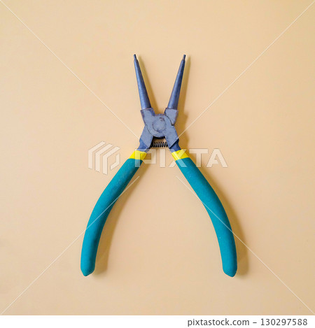 Round nose pliers or rosary pliers on color background. Round nose pliers or rosary pliers on color background. 130297588