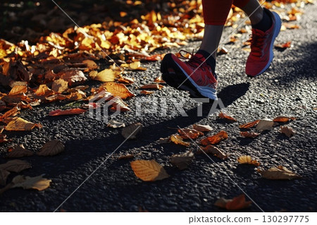 Runners Feet Pounding the Pavement Among Autumn Leaves Runners Feet Pounding the Pavement Among Autumn Leaves 130297775