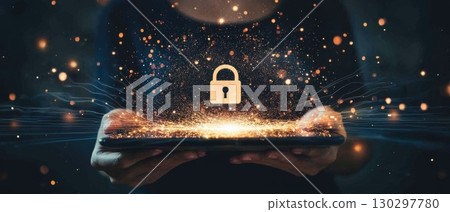 A person is holding a tablet with a glowing lock on it A person is holding a tablet with a glowing lock on it 130297780