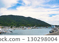 Scenery of a fishing port with mountains in the background 130298004