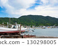 A view of the fishing port with the mountains behind it 130298005