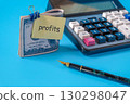A dollars on a clip with note paper and calculator  ,Finance and business for profits concept. 130298047