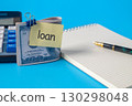 A dollars on a clip with note paper and calculator  ,Finance and business for loan concept. 130298048