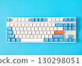 Computer keyboard on blue background. Top view 130298051