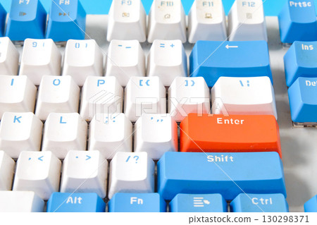 Computer keyboard on blue background. Top view 130298371