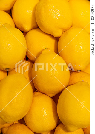 Close-up Ripe Yellow Lemons Background Or Texture. Lemon Harvest, Many Yellow Lemons. Close-up Ripe Yellow Lemons Background Or Texture. Lemon Harvest, Many Yellow Lemons. 130298972