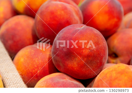 Fresh, Juicy Peaches Beautifully Arranged in a Market Display 130298973