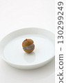 Longan pulp and seeds served on a plate 130299249