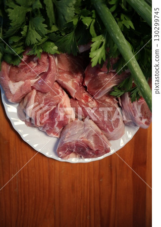 Fresh Lamb Meat with Parsley on Plate. Meat Prepared for Cooking. 130299745