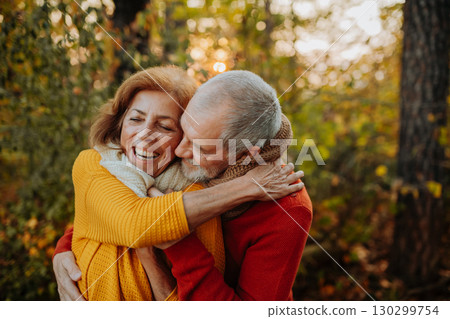 Portrait of senior couple in autumn nature. 130299754