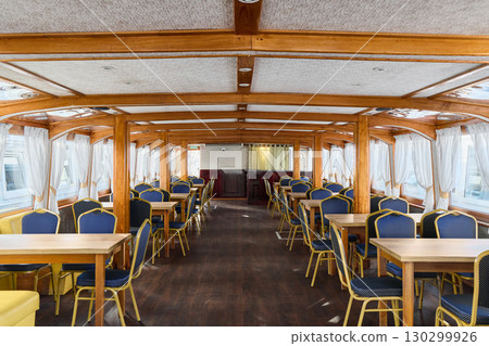Discover the Elegant Interior of a Beautiful Dining Area Located on a Magnificent Boat Discover the Elegant Interior of a Beautiful Dining Area Located on a Magnificent Boat 130299926