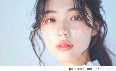 Portrait of a beautiful woman looking back gracefully 130299978