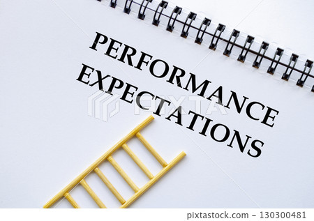 PERFORMANCE EXPECTATIONS, A professional notebook with ladder showing performance expectations concept 130300481