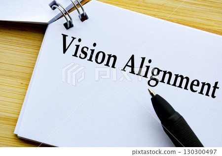 A professional notepad with pen showing vision alignment concept 130300497