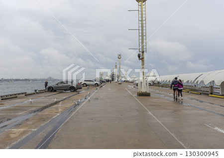 Geelong, Australia - January 2,2024 : Cunningham pier with blue sky in Geelong, Australia on January 2,2024 . Geelong, Australia - January 2,2024 : Cunningham pier with blue sky in Geelong, Australia on January 2,2024 . 130300945