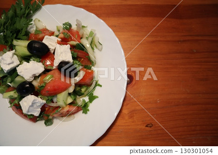 Freshly Made Mediterranean Salad on White Plate. 130301054