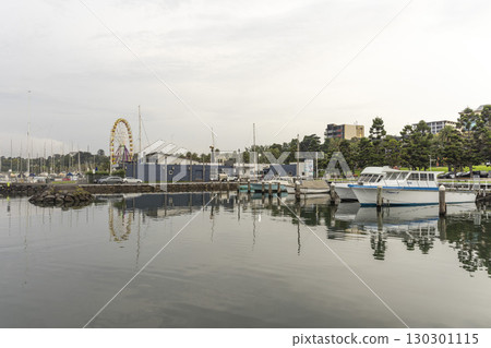 Geelong, Australia - January 2,2024 : Sailboats moor at Geelong Harbour with blue sky in Geelong, Australia on January 2,2024 . Geelong, Australia - January 2,2024 : Sailboats moor at Geelong Harbour with blue sky in Geelong, Australia on January 2,2024 . 130301115