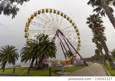 Geelong, Australia - January 2,2024 : Giant Sky Wheel at recreation area on the north shores of Corio Bay in Geelong, Australia on  January 2,2024 . Geelong, Australia - January 2,2024 : Giant Sky Wheel at recreation area on the north shores of Corio Bay in Geelong, Australia on  January 2,2024 . 130301127