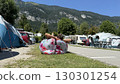 Relaxing at a Campsite with Inflatable Chair 130301254
