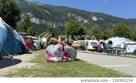 Relaxing at a Campsite with Inflatable Chair 130301254