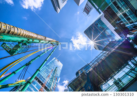 Tokyo cityscape, Japan, September 1st. Huge heavy machinery such as crawler cranes and pile drivers are lined up... = Shibuya Tokyo cityscape, Japan, September 1st. Huge heavy machinery such as crawler cranes and pile drivers are lined up... = Shibuya 130301310