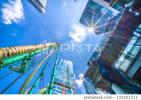 Tokyo cityscape, Japan, September 1st. Huge heavy machinery such as crawler cranes and pile drivers are lined up... = Shibuya Tokyo cityscape, Japan, September 1st. Huge heavy machinery such as crawler cranes and pile drivers are lined up... = Shibuya 130301311