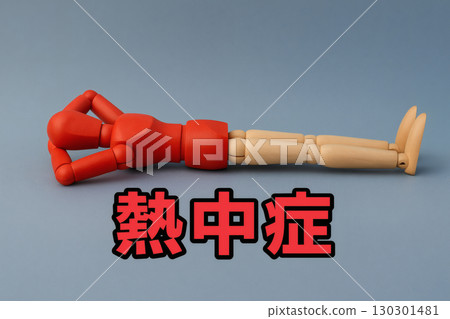 A photo of a doll collapsing from heatstroke in the summer heat and a warning about health hazards 130301481