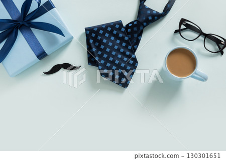 Happy Fathers Day greeting card with gift box, coffee, notebook. 130301651