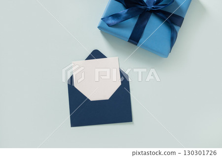 Happy Fathers Day gift box and label on blue background. View from above. 130301726