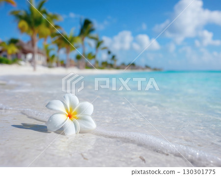 White plumeria and clear emerald blue sea on a tropical beach 130301775