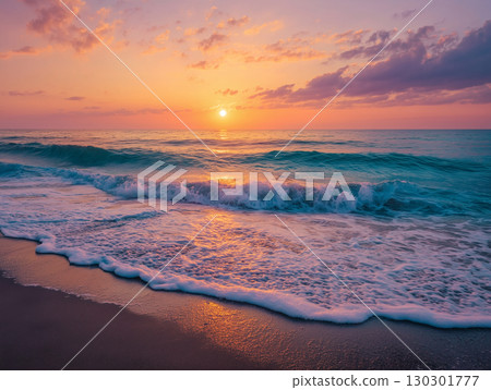 A beautiful seaside scene with gentle waves and the shore dyed in the sunset 130301777