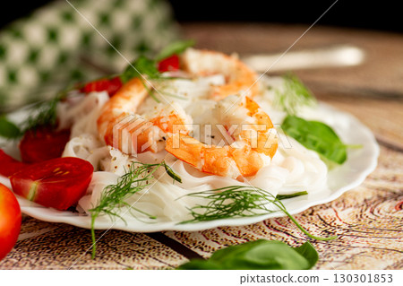 Asian lunch boiled rice noodles shrimp on a wooden table Asian lunch boiled rice noodles shrimp on a wooden table 130301853