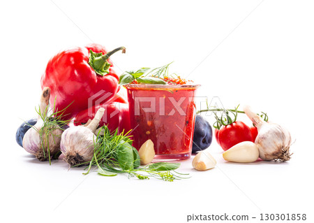 Delicious spicy tomato paste with basil and garlic cloves Delicious spicy tomato paste with basil and garlic cloves 130301858