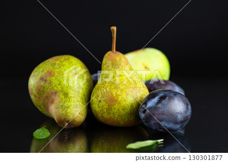 Natural fresh pears and plums in macro photography Natural fresh pears and plums in macro photography 130301877