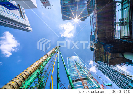 Tokyo cityscape, Japan, September 1st. Huge heavy machinery such as crawler cranes and pile drivers are lined up... = Shibuya 130301948