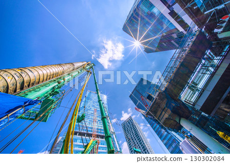 Tokyo cityscape, Japan, September 1st. Huge heavy machinery such as crawler cranes and pile drivers are lined up... = Shibuya 130302084