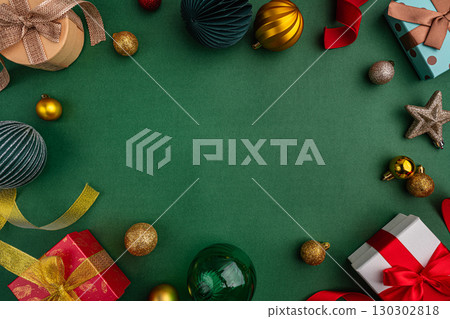Christmas Gifts and Ornaments Border on Green Background Christmas Gifts and Ornaments Border on Green Background 130302818