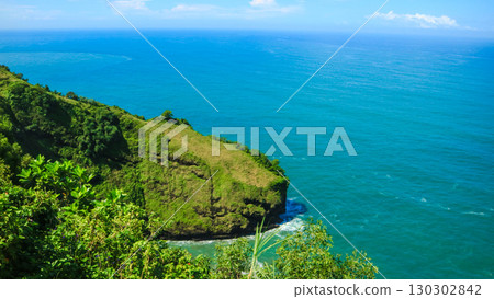 Awesome view of bukit jerit in Indonesia. Amazing cliff and ocean tropical island Awesome view of bukit jerit in Indonesia. Amazing cliff and ocean tropical island 130302842