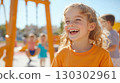 Child's joyful laughter at playground 130302961
