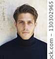 close up portrait of a young man in a turtleneck. 130302965