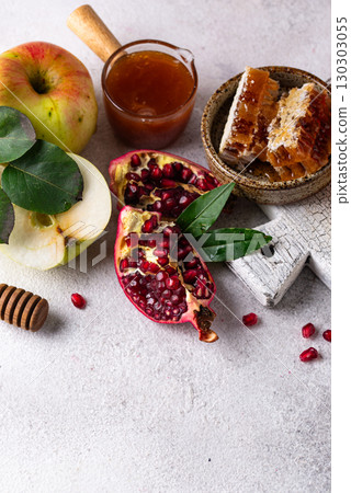 Rosh Hashana concept with honey, apple and pomegranate Rosh Hashana concept with honey, apple and pomegranate 130303055