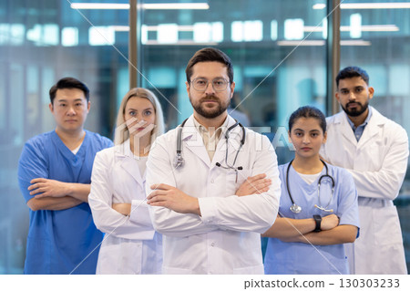 Group of healthcare professionals standing together, looking confident and ready to work in a modern medical setting. Group of healthcare professionals standing together, looking confident and ready to work in a modern medical setting. 130303233