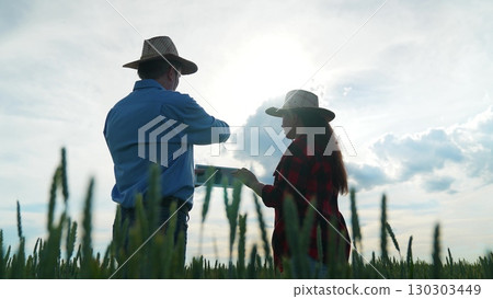 New deal in the village, Responsible farming handshake, United farmers on wheat field, Growing together in agriculture, Friendly relationship on nature, Strong connection in rural business, Two men New deal in the village, Responsible farming handshake, United farmers on wheat field, Growing together in agriculture, Friendly relationship on nature, Strong connection in rural business, Two men 130303449