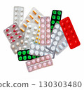 Medicines in the form of multi-colored tablets in blisters on a white background 130303480