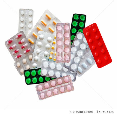 Medicines in the form of multi-colored tablets in blisters on a white background 130303480
