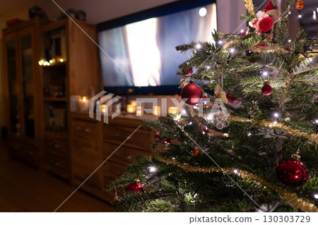 Christmas Candle with Warm Light and Christmas Tree 130303729