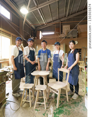 Group photo of staff at the woodworking factory 130303874